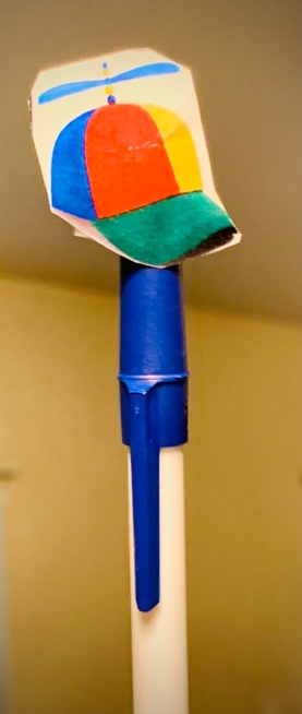 A blue and white pole with a sponge on it

Description automatically generated