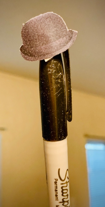 A close-up of a pen

Description automatically generated