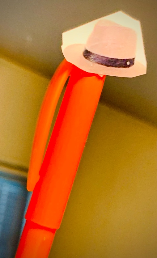 A close up of a pen

Description automatically generated